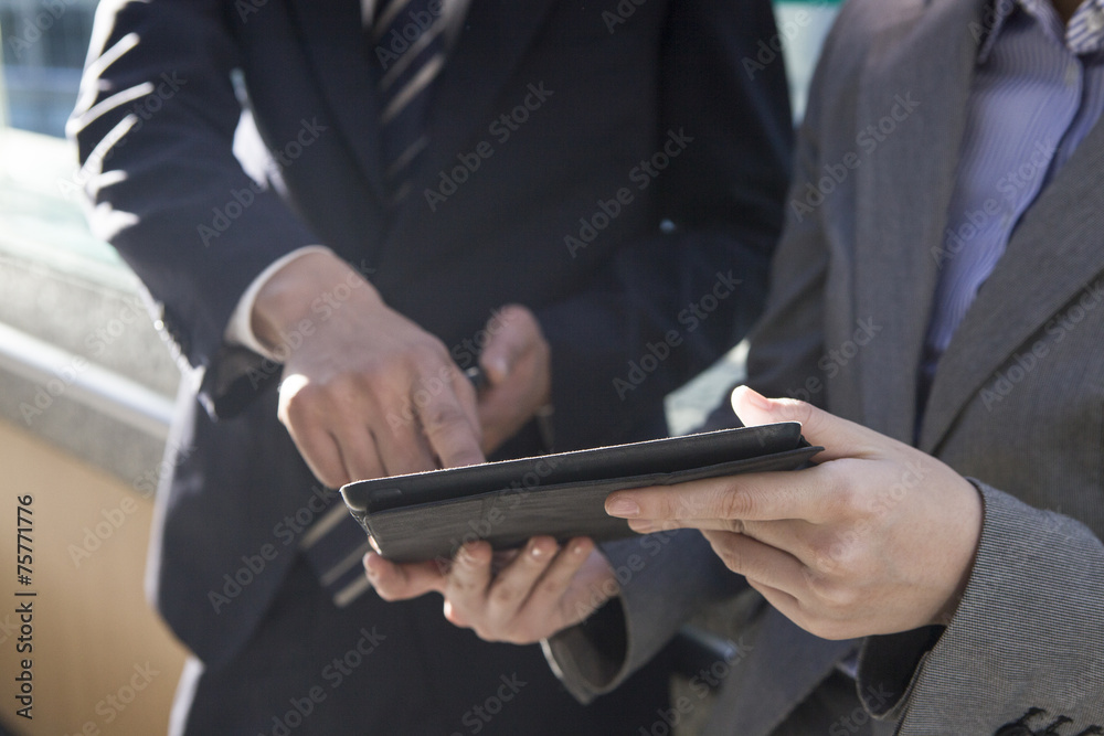 People who are pointing the electronic tablet People who are pointing the electronic tablet