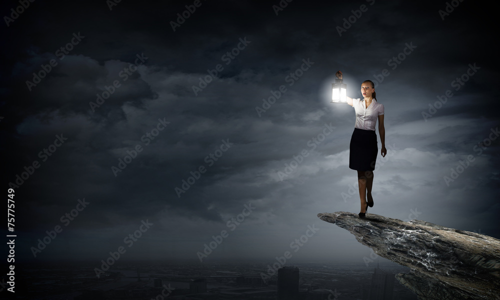 Businesswoman with lantern Businesswoman with lantern