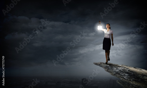 Businesswoman with lantern