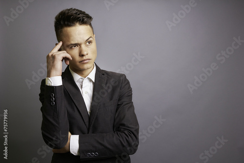 Pensive man in formal wear.