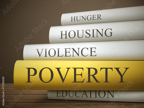 book title of poverty isolated on a wooden table