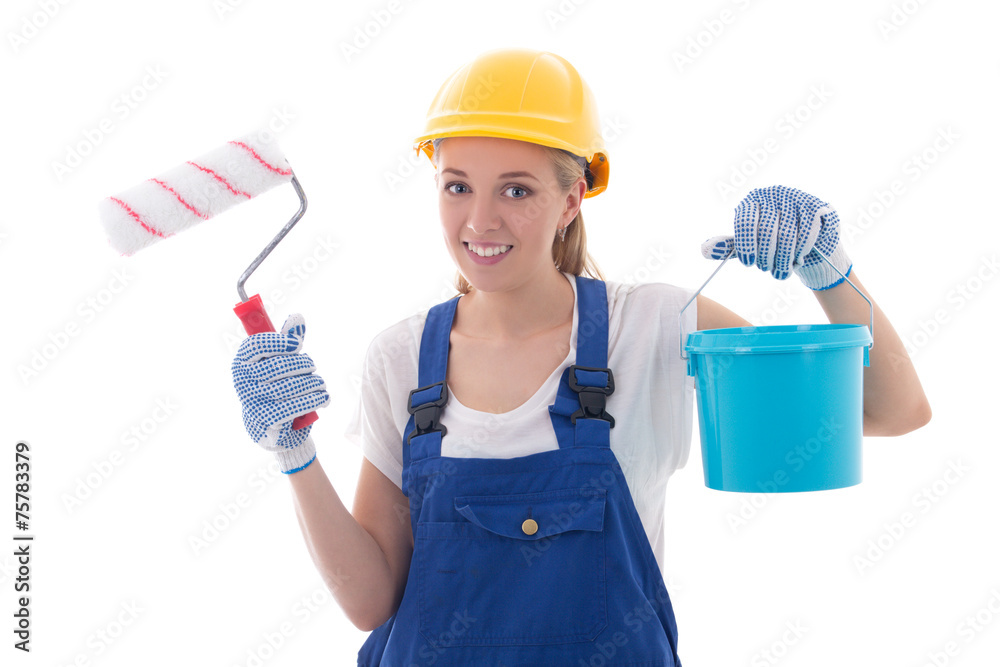 young woman painter in blue builder uniform with paint brush and young woman painter in blue builder uniform with paint brush and
