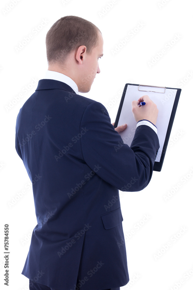 back view of young businessman in suit writing something in clip back view of young businessman in suit writing something in clip