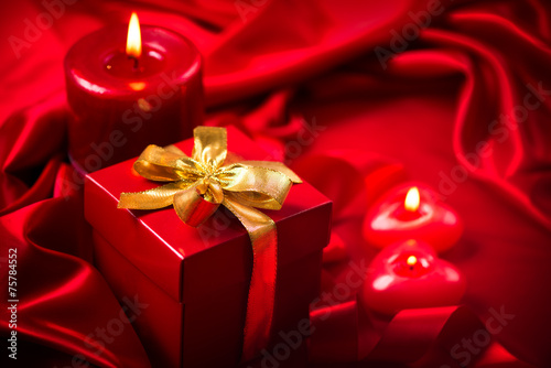 Valentine's Day. Valentine red hearts, red candles and gift box © Subbotina Anna