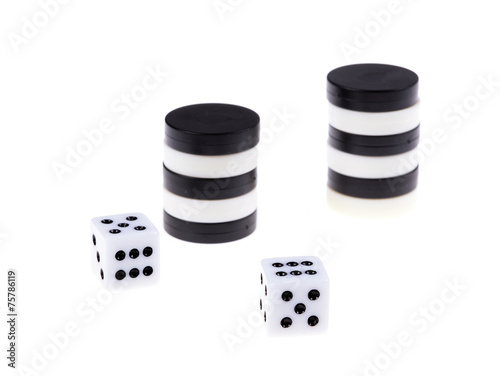 Stacked backgammon black and white pieces and dice