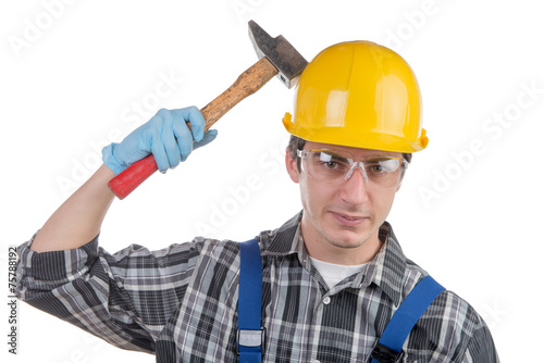 young worker with a hammer