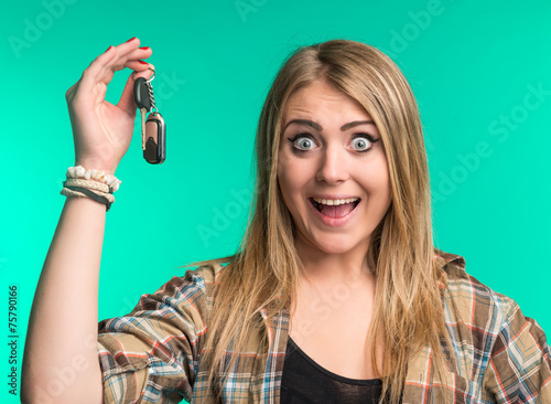 Happy woman holding car keys