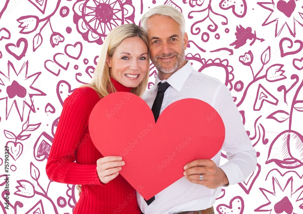 Composite image of handsome man getting a heart card form wife Composite image of handsome man getting a heart card form wife