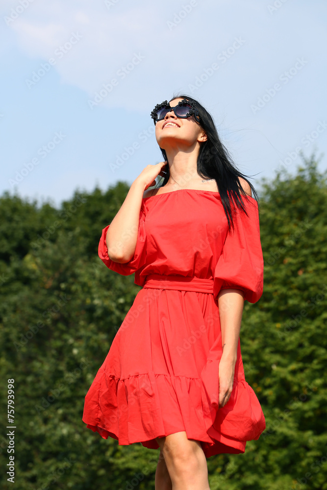 Happy young woman in red dress Happy young woman in red dress