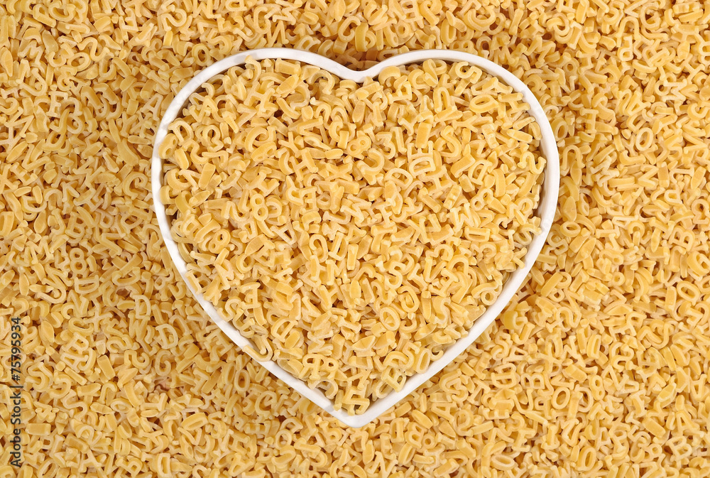 Alphabet pasta in plate in the form of heart Alphabet pasta in plate in the form of heart