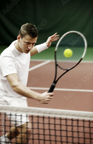Young man playing tennis © Mikael Damkier