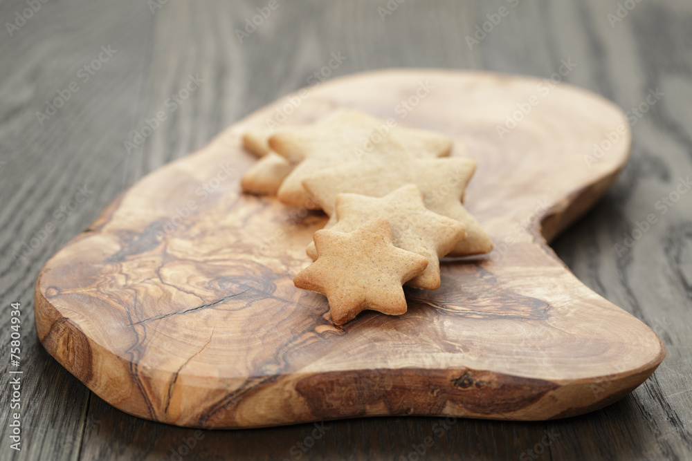 homemade star shape ginger cookies on olive board homemade star shape ginger cookies on olive board