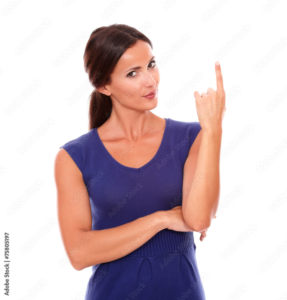Beautiful young female pointing up smiling Beautiful young female pointing up smiling