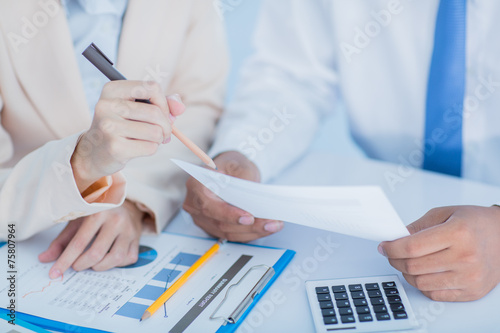 Business people discussing the charts and graphs showing the res