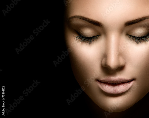 Beauty woman face closeup isolated on black background