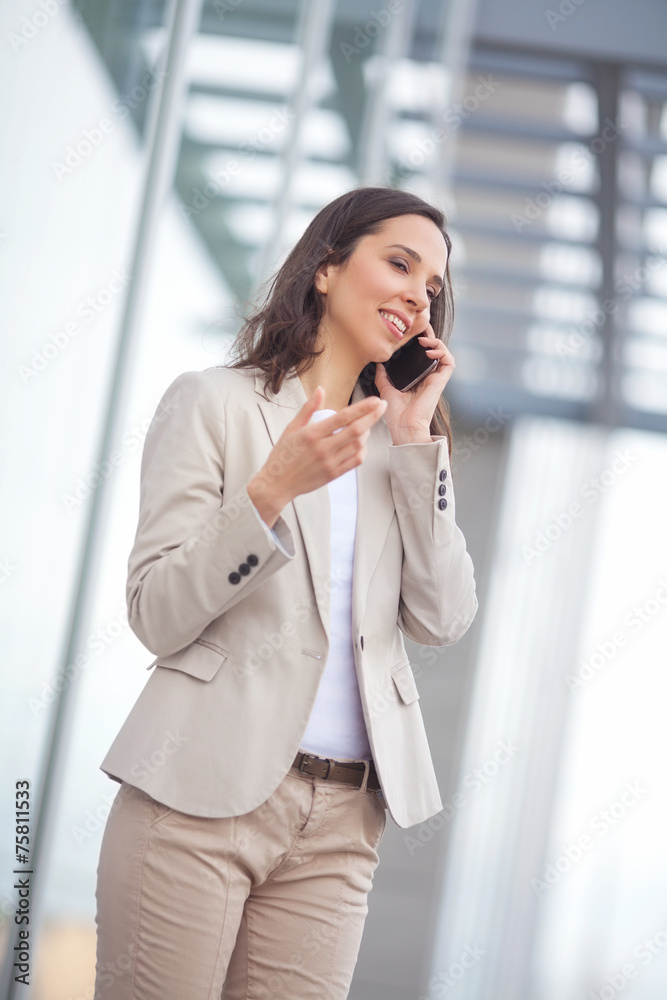 Portrait of a confident businesswoman talking on the phone. Portrait of a confident businesswoman talking on the phone.