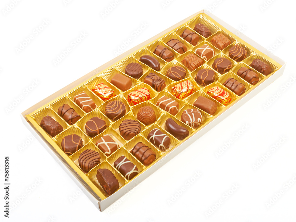 Large box of sweet chokolate candies isolated on white. Large box of sweet chokolate candies isolated on white.