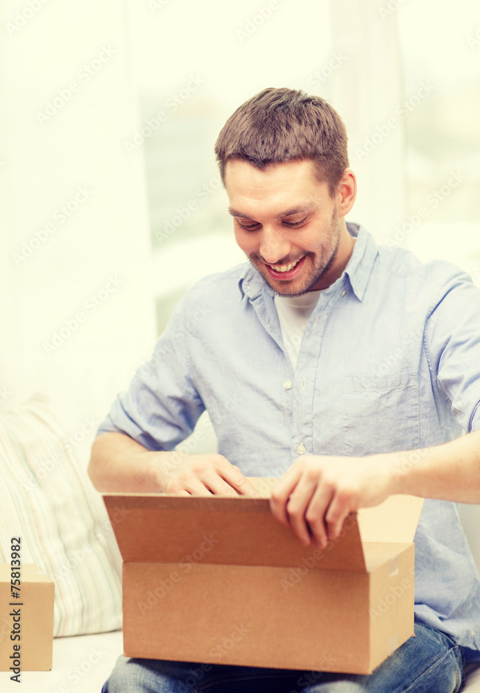 man with cardboard boxes at home man with cardboard boxes at home