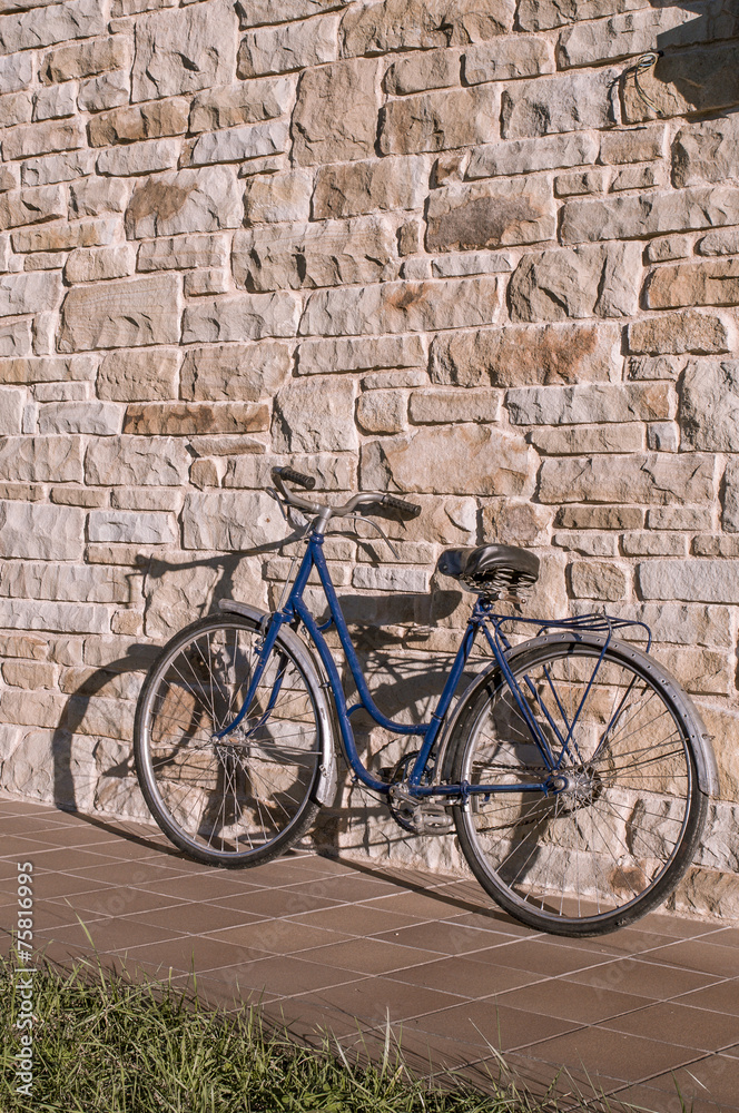 Old or classic bicycle on a stone wall