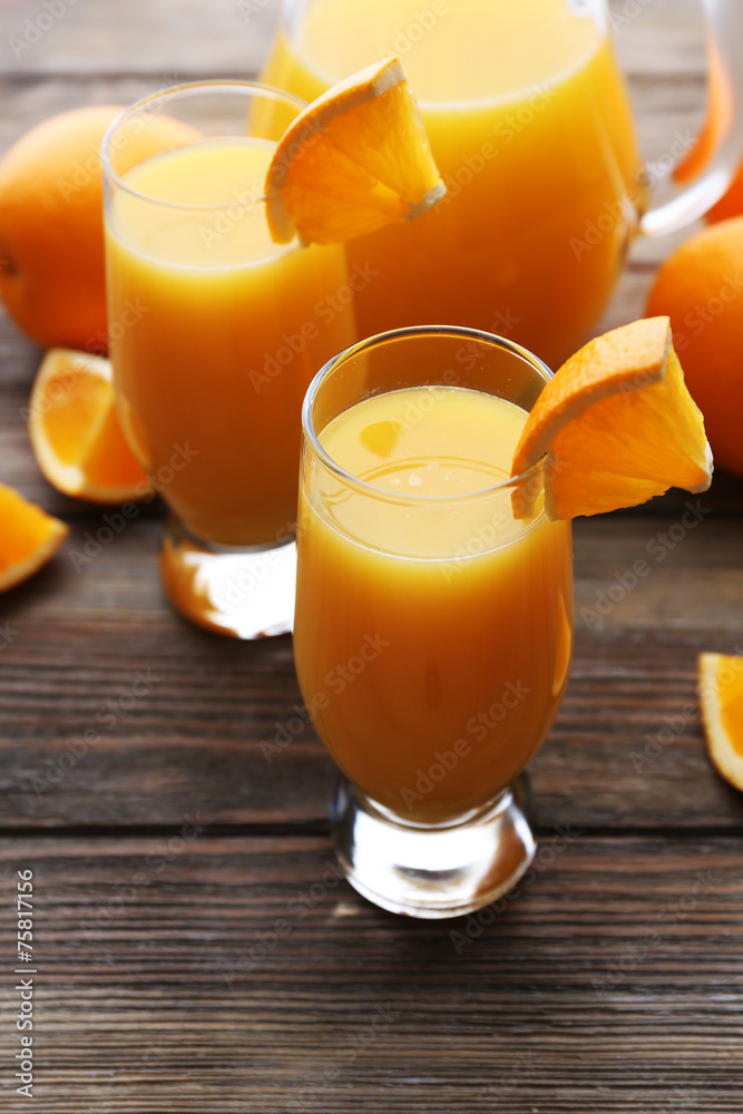 Freshly squeezed orange juice on wooden table