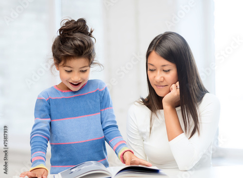 mother and daughter with book