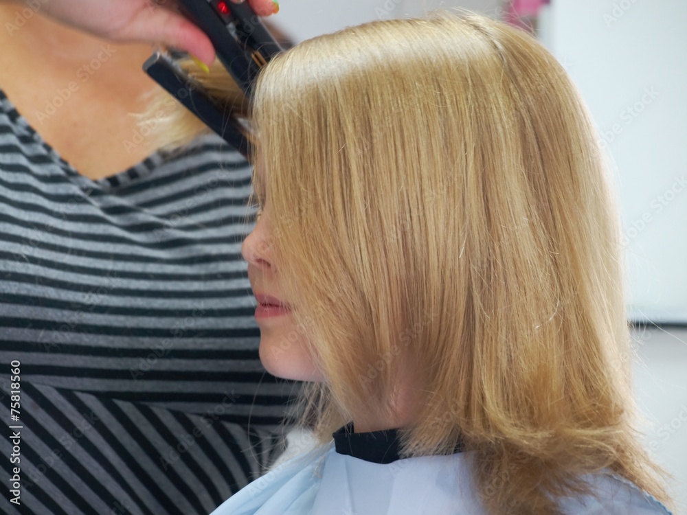 Fototapeta premium Little girl in hair salon
