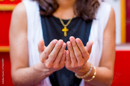 Christian Women believer praying to God  and Cross necklace