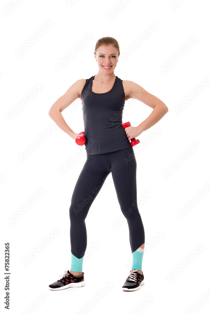 Cute athlete with dumbbells smiling at camera Cute athlete with dumbbells smiling at camera
