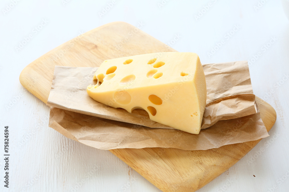 Piece of cheese on a board