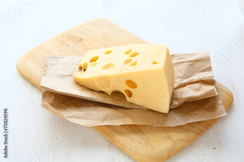 Piece of cheese on a board
