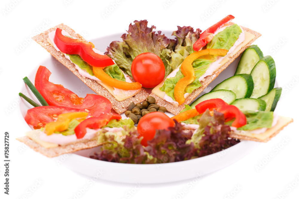 Crackers with fresh vegetables and cheese Crackers with fresh vegetables and cheese