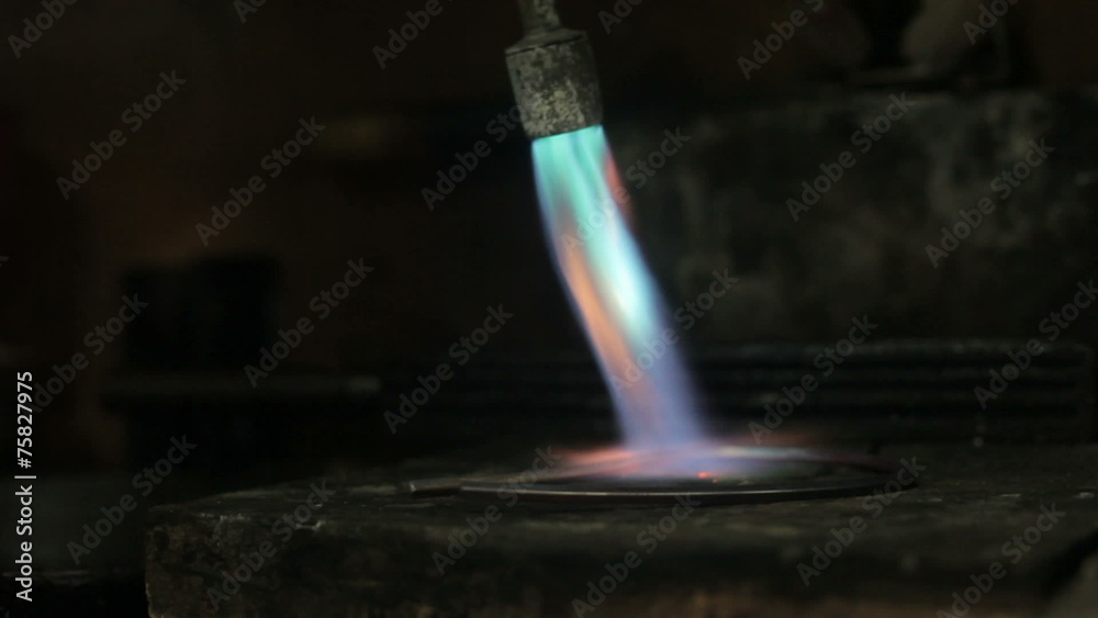 video footage of melting dowm metal in a Jewelry, metal burn Stock Video Adobe Stock