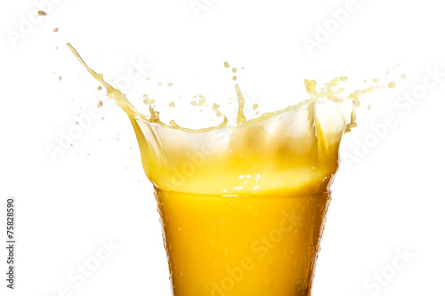 Orange juice. Splash in glass. Isolated on white