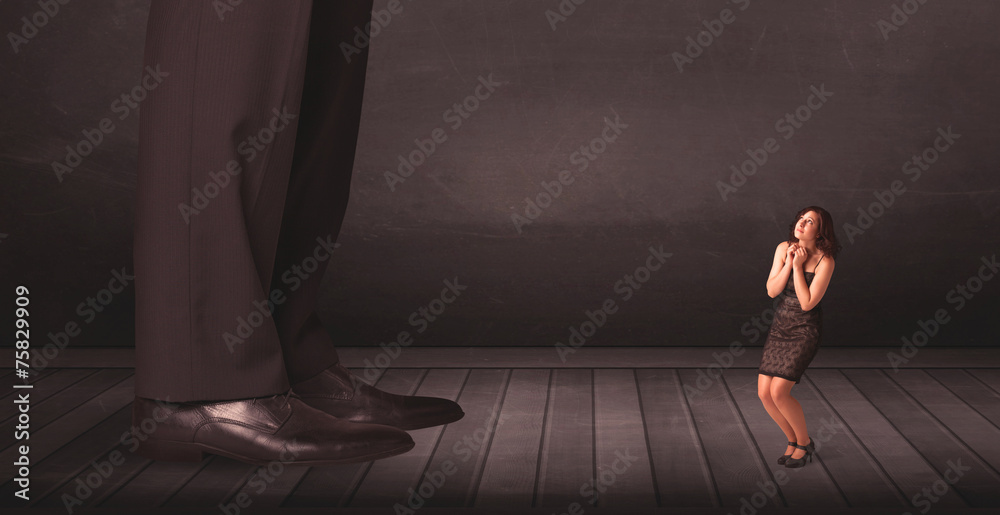 Big person with small businesswoman concept