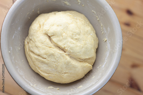 Bowl full of dough ready for rolling.