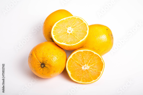 Whole and Half Naval Oranges on White