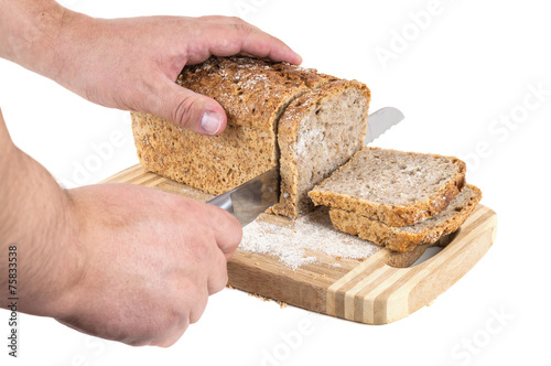 Hand cutting wholemeal bread