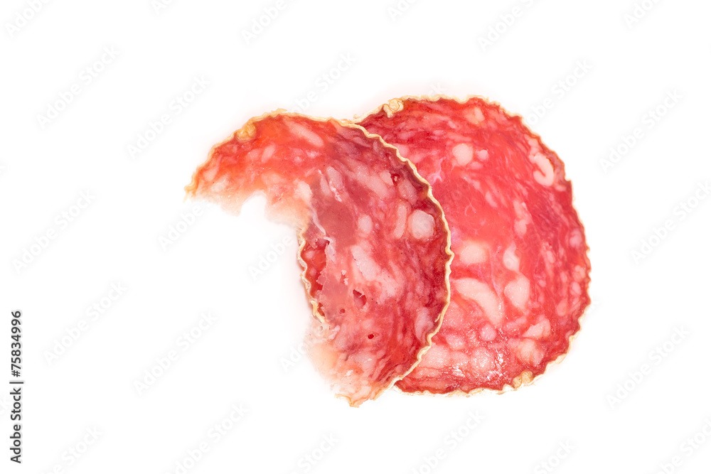 Slice of salami sausage on a white background Slice of salami sausage on a white background