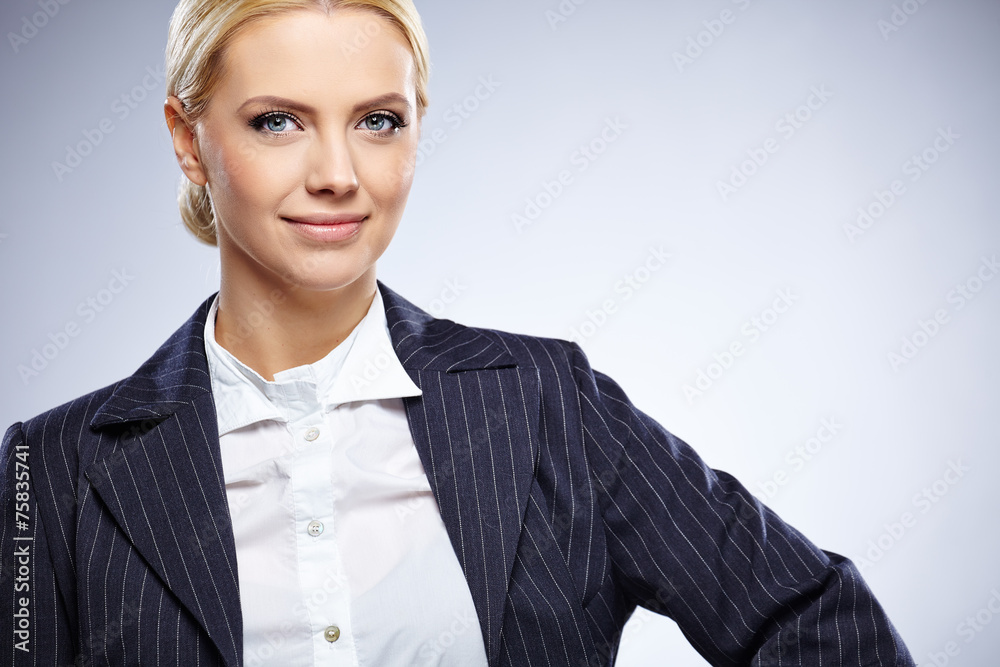 Portrait of a beautiful young business woman standing against bl Portrait of a beautiful young business woman standing against bl