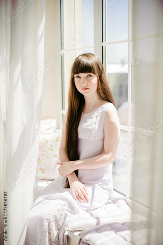 one young girl on the window Free Download one young girl on the window - GFXLoad