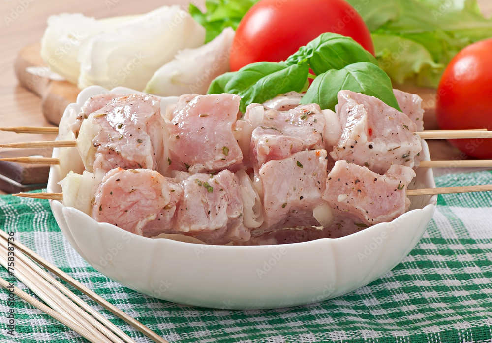 Prepared marinated with onions and herbs pieces of meat Prepared marinated with onions and herbs pieces of meat