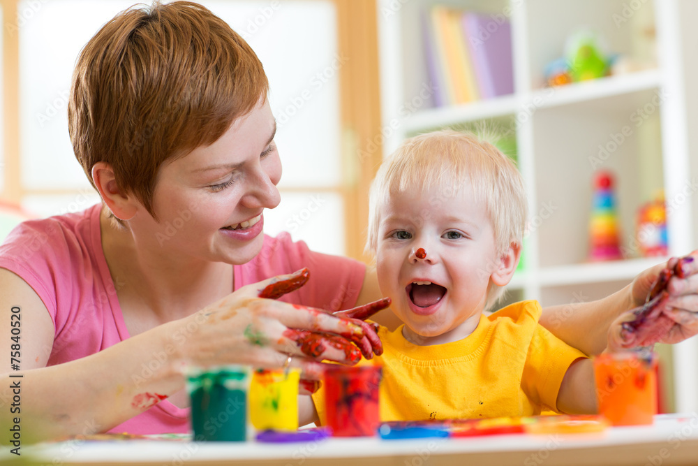 mother and child paint together at home mother and child paint together at home
