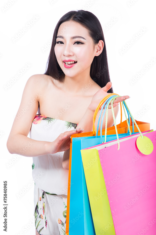 young woman with shopping bags over white background
