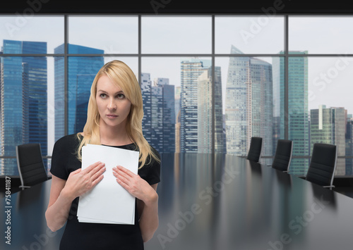 businesswoman holding documents photo