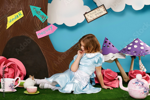 Beautiful little girl long hear blue dress with rabbit