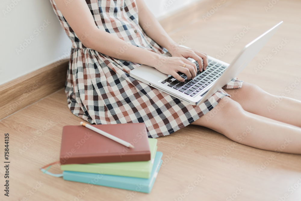 Fototapeta premium Asian woman using laptop at home