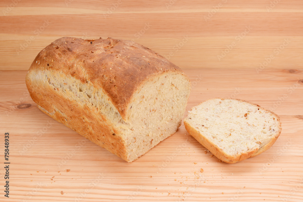 Cut slice from a freshly baked loaf of bread Cut slice from a freshly baked loaf of bread