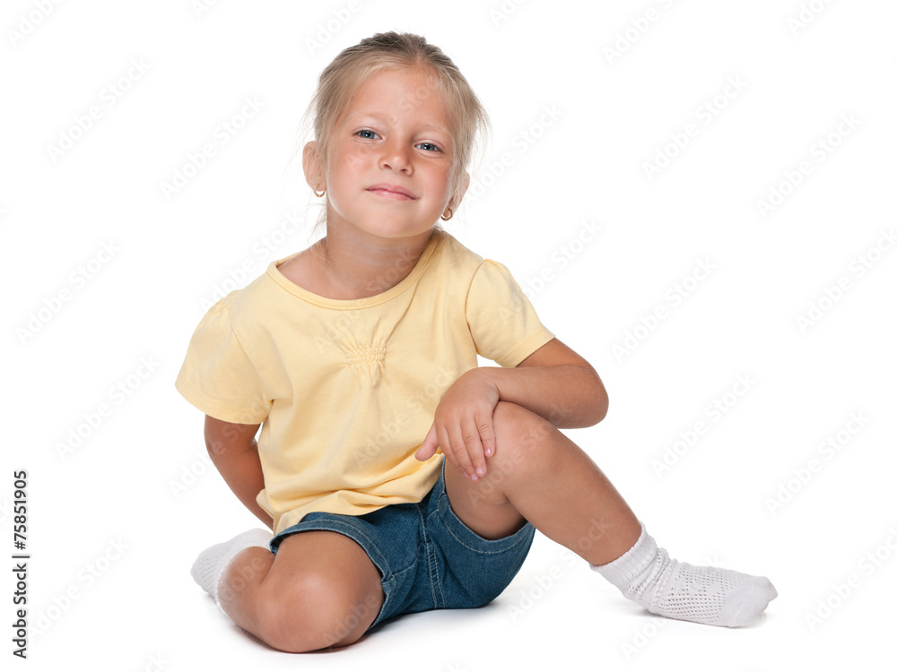 Pretty little girl sits on the white background Pretty little girl sits on the white background
