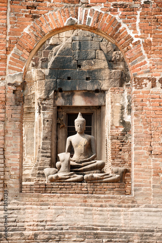 Ancient Buddha in Phra Phang Sam Yod temple Thailand.