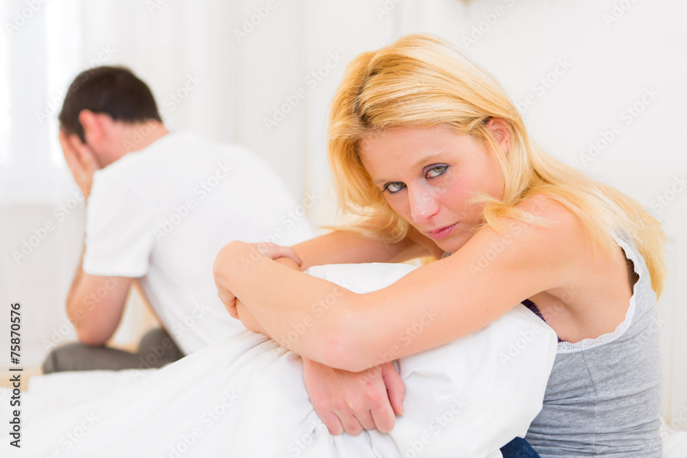 Young attractive couple having an argue in bed Young attractive couple having an argue in bed
